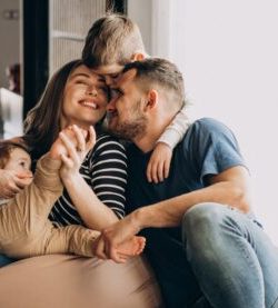 Young family with their sons at home having fun Young family with their sons at home having fun